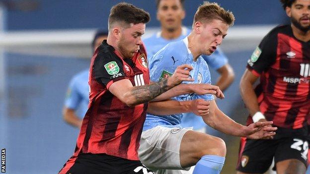 Bournemouth centre-half Jack Simpson (left) in action against Manchester City