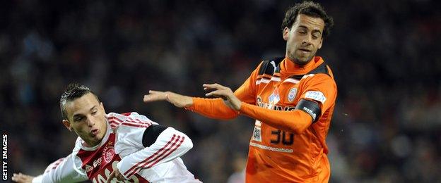 Rodney Sneijder (left) in action for Ajax