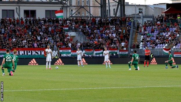 The Republic's players take a knee before Tuesday's game in Budapest