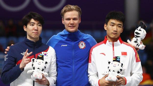 South Korea's Cha Min-kyu (left), Norway's Havard Lorentzen and China's Gao Tingyu