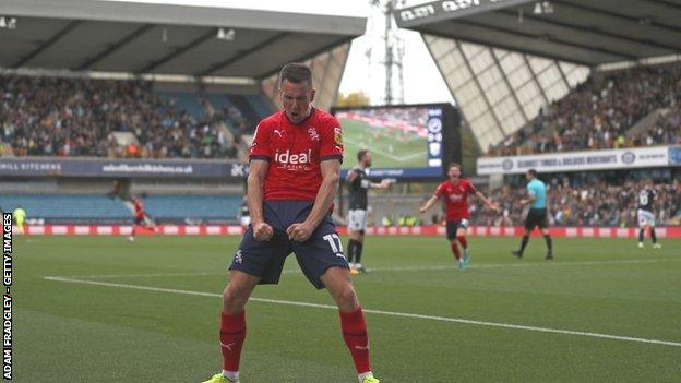 Millwall's Jed Wallace celebrates their opening goal