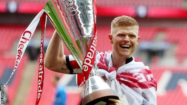 Elliott Whitehouse celebrates Lincoln City's victory in the Checkatrade Trophy final