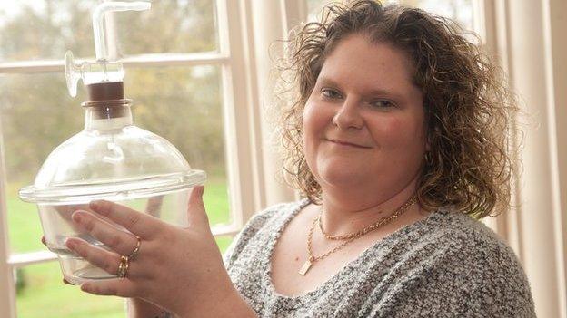 Louise Brown holds the container in which she was created