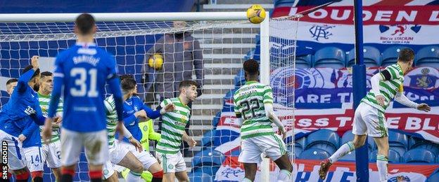 Callum McGregor (right) looks on as the ball goes into his own net off his shoulder