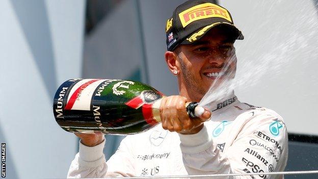 Lewis Hamilton spraying champagne