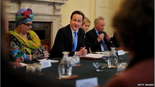 Camila Batmanghelidjh (L), sits beside Prime Minister, David Cameron