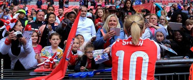 Kelly Smith signs autographs for fans