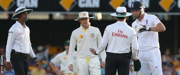 Australia captain Michael Clarke (second from left) was fined for his part in a clash with England bowler James Anderson (right)