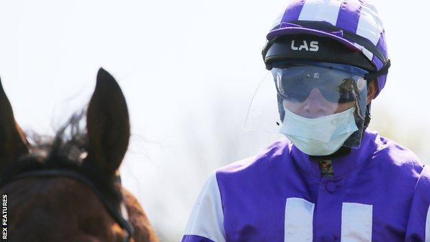 A jockey at Hanover in Germany, where racing resumed earlier this month