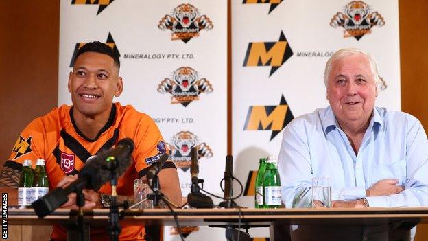 Israel Folau and Clive Palmer speak at a press conference in Brisbane