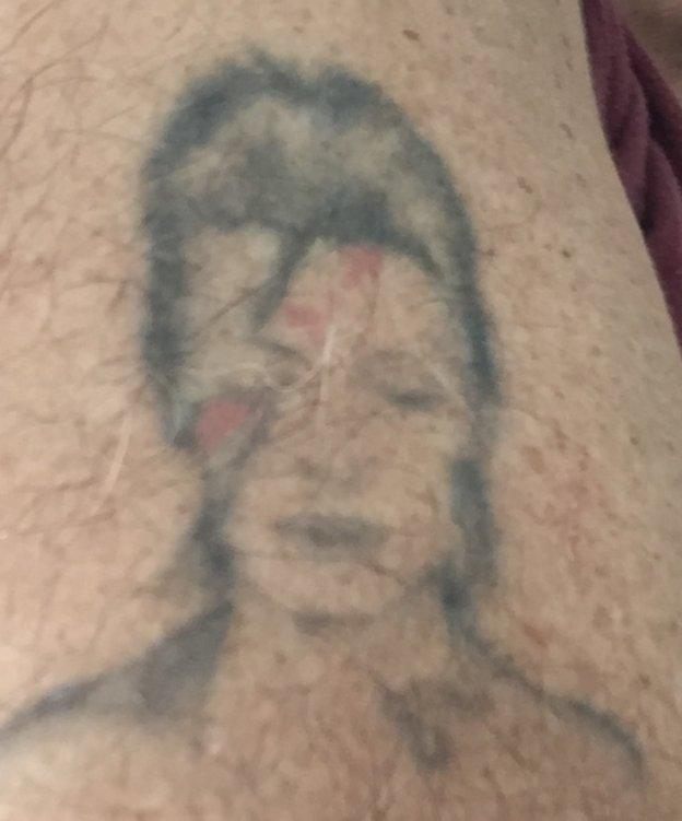 Tattoo of David Bowie's Aladdin Sane on Lawrence Hill