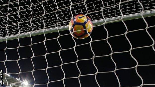 A ball hits the back of the net