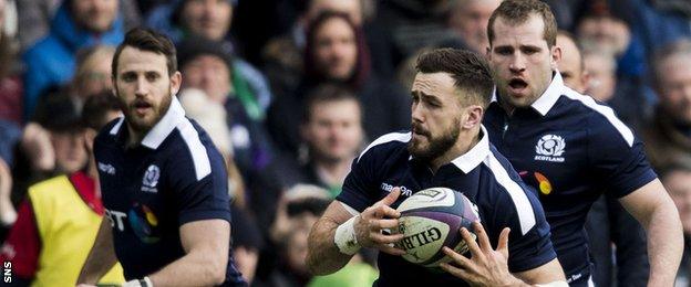 Alex Dunbar carries for Scotland against Ireland, supported by Tommy Seymour and Fraser Brown