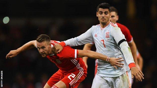 Chris Gunter battles with Alvaro Morata