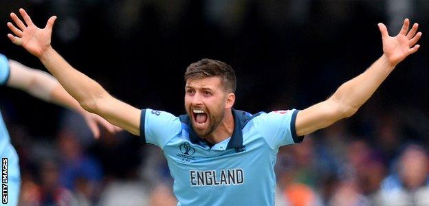 Mark Wood celebrates a wicket in the World Cup