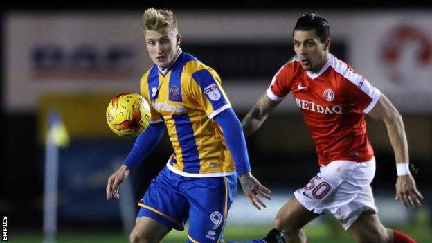 Stephen Humphrys holds off a challenge from Charlton's Jorge Teixeira