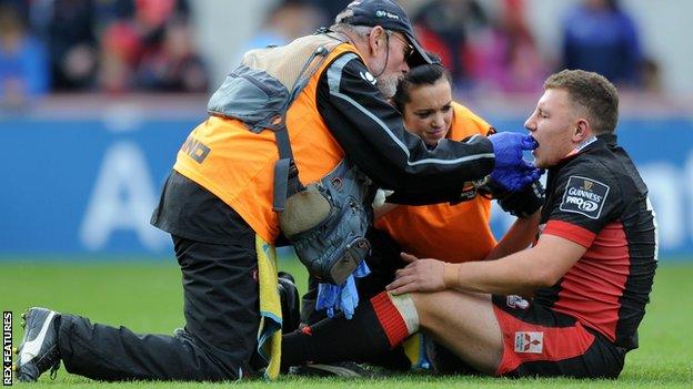 Duncan Weir is treated after taking a knock to his head in the match against Munster at Limerick's Thomond Park