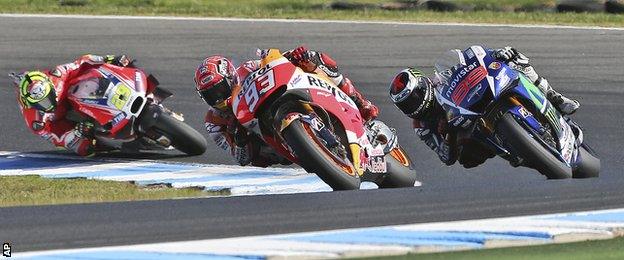 Marc Marquez of Spain (center) leads Jorge Lorenzo of Spain (right) and Andrea Iannone of Italy