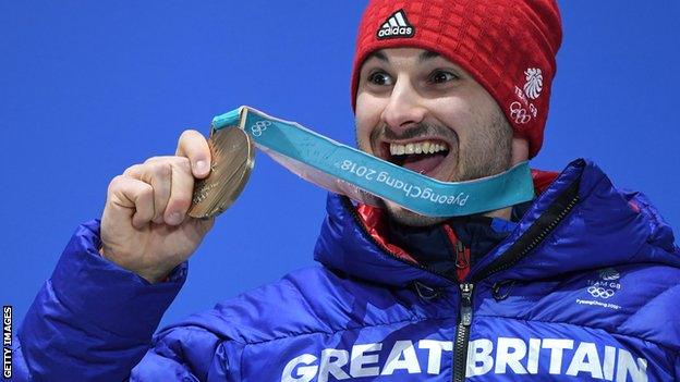 Britain's bronze medallist Dom Parsons poses on the podium during the medal ceremony for the men's skeleton at the Pyeongchang Medals Plaza during the Pyeongchang 2018 Winter Olympic Games