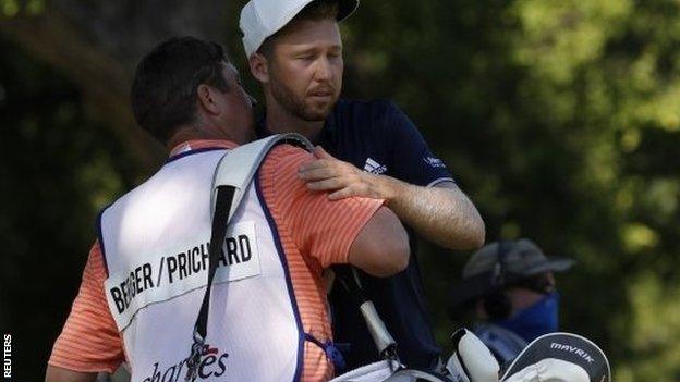 Daniel Berger and his caddie embrace