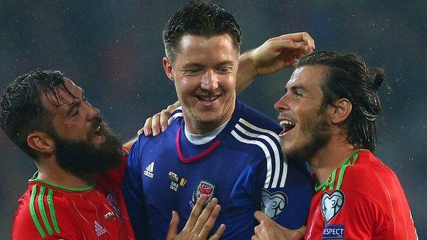 Joe Ledley, Wayne Hennessey and Gareth Bale celebrate