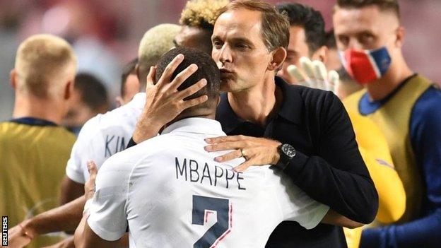 Thomas Tuchel kisses Kylian Mbappe