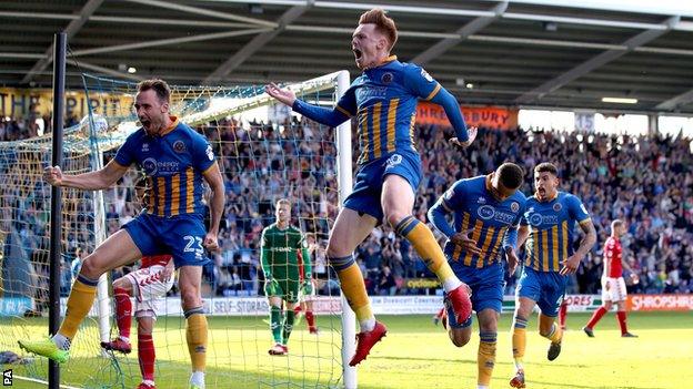 Shrewsbury Town's players celebrate their winner in the play-off second leg against Charlton