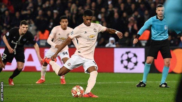 Marcus Rashford scores an injury-time penalty to knock PSG out of this season's Champions League