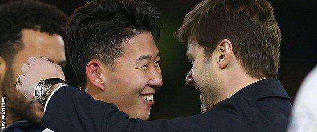 Son Heung-Min (left) is congratulated by manager Mauricio Pochettino after his winner for Spurs