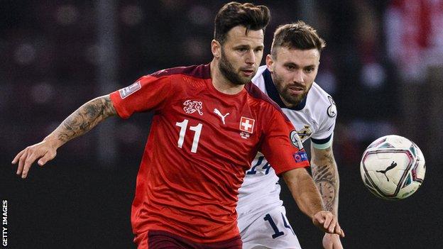 Stuart Dallas battles with Switzerland's Renato Steffen in the recent World Cup qualifier in Geneva