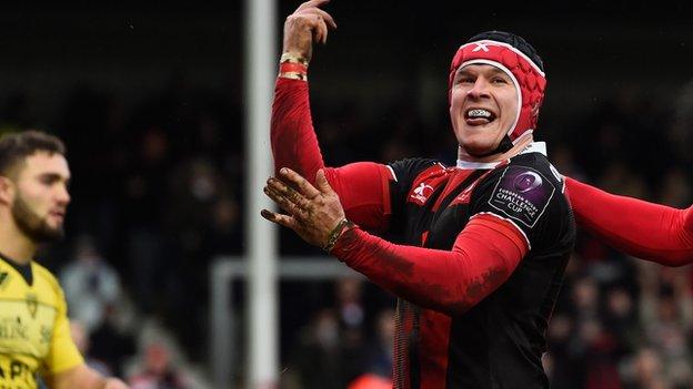 Rob Cook celebrates his try for Gloucester