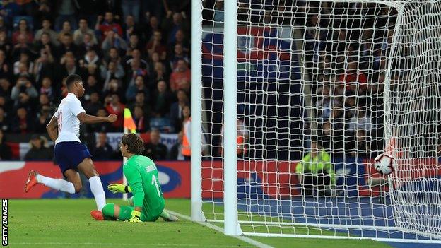 Marcus Rashford scores for England