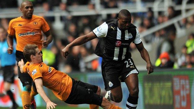 Shola Ameobi is tackled by Wolves' Dave Edwards, February 2012