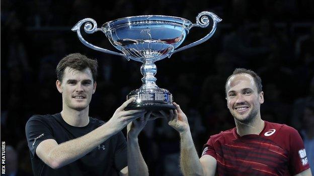 Jamie Murray (left) and Bruno Soares hold aloft their trophy for ending the season as the world number one doubles pairing, despite losing in London