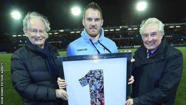 Peter Thomas (left) and Gareth Edwards (right) make a special presentation to Gethin Jenkins on the player's retirement from rugby