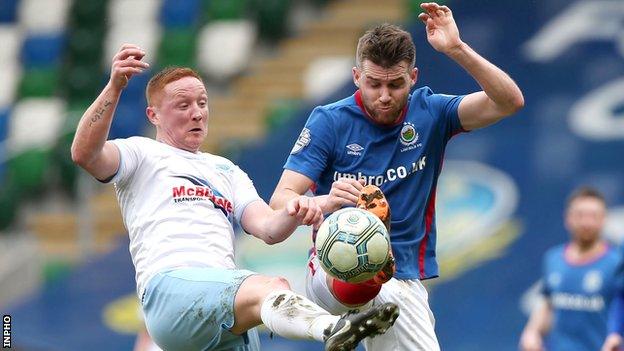 Stephen McAlorum battles with Linfield's Stephen Lowry in April
