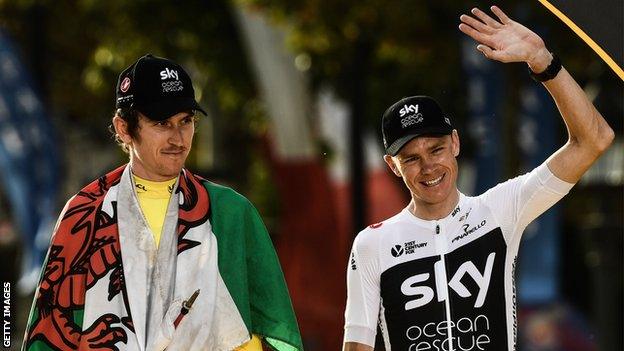 Geraint Thomas is draped in the Wales flag stood next to a waving Chris Froome on the podium in Paris