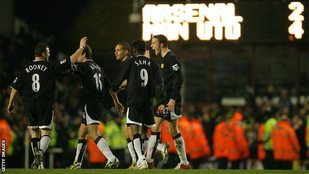 Manchester United players celebrate at High bury in 2005