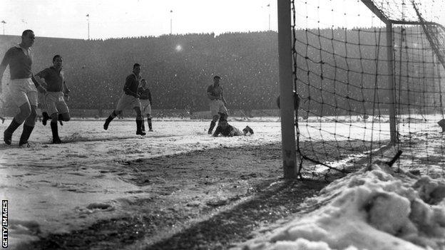 Blackpool score their first goal against Chelsea on a snow-covered pitch at Stamford Bridge in March 1947