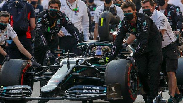 Mercedes team with Lewis Hamilton's car