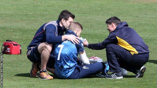 Sam Billings receiving treatment