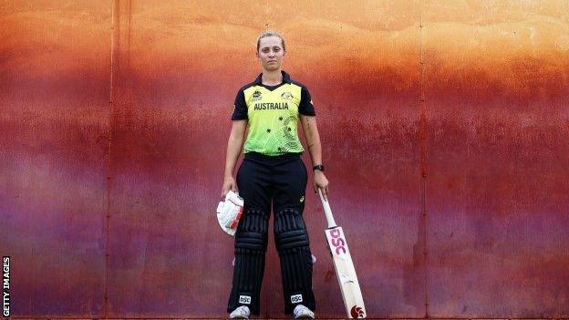 Ash Gardner in kit with bat