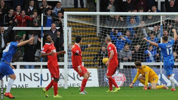 Jake Gray (left) celebrates his first goal against Leyton Orient