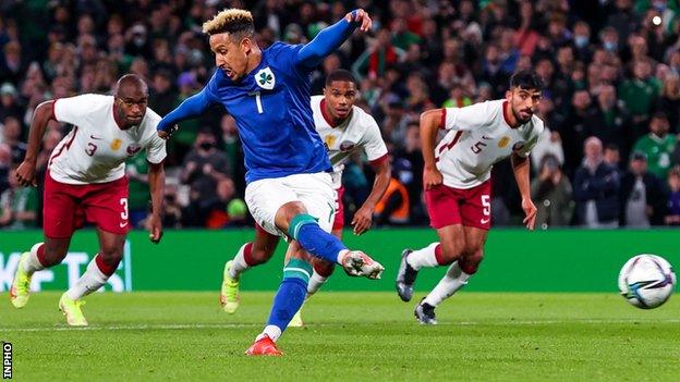 Callum Robinson scores his penalty against Qatar