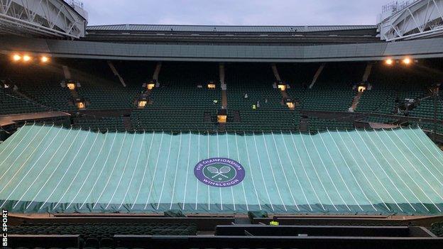 Centre Court under cover on Tuesday