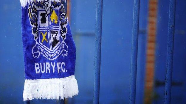 Bury scarf tied to the fence