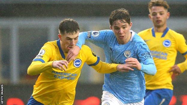 Jensen Weir (left) in action for Brighton under-23s