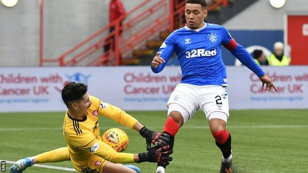 Luke Southwood in action for Hamilton against Rangers' James Tavernier