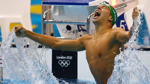 Chad Le Clos celebrates his gold medal in the celebrates after winning gold in the Men's 200m butterfly final at the London 2012 Olympic Games