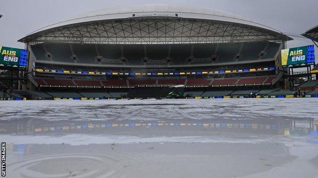 A general view of the Adelaide Oval as rain falls on the covers